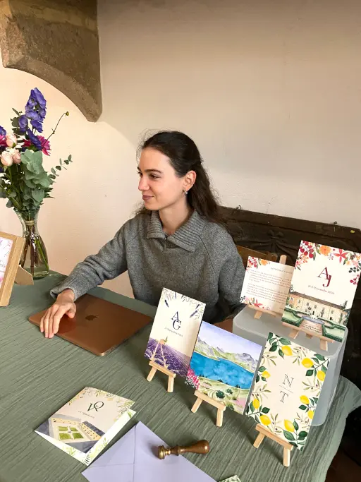 Stand de faire-part de mariage à l'aquarelle au salon de mariage de Pérouges